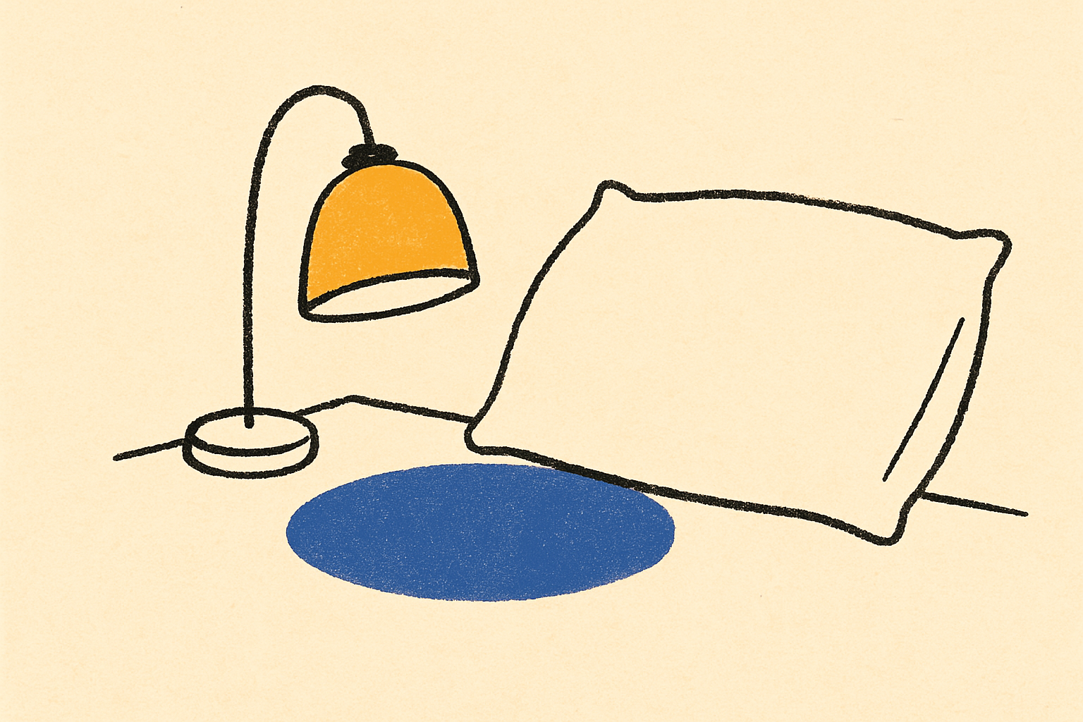 An ink bedside lamp casting a small pool of indigo light across an empty cream pillow.